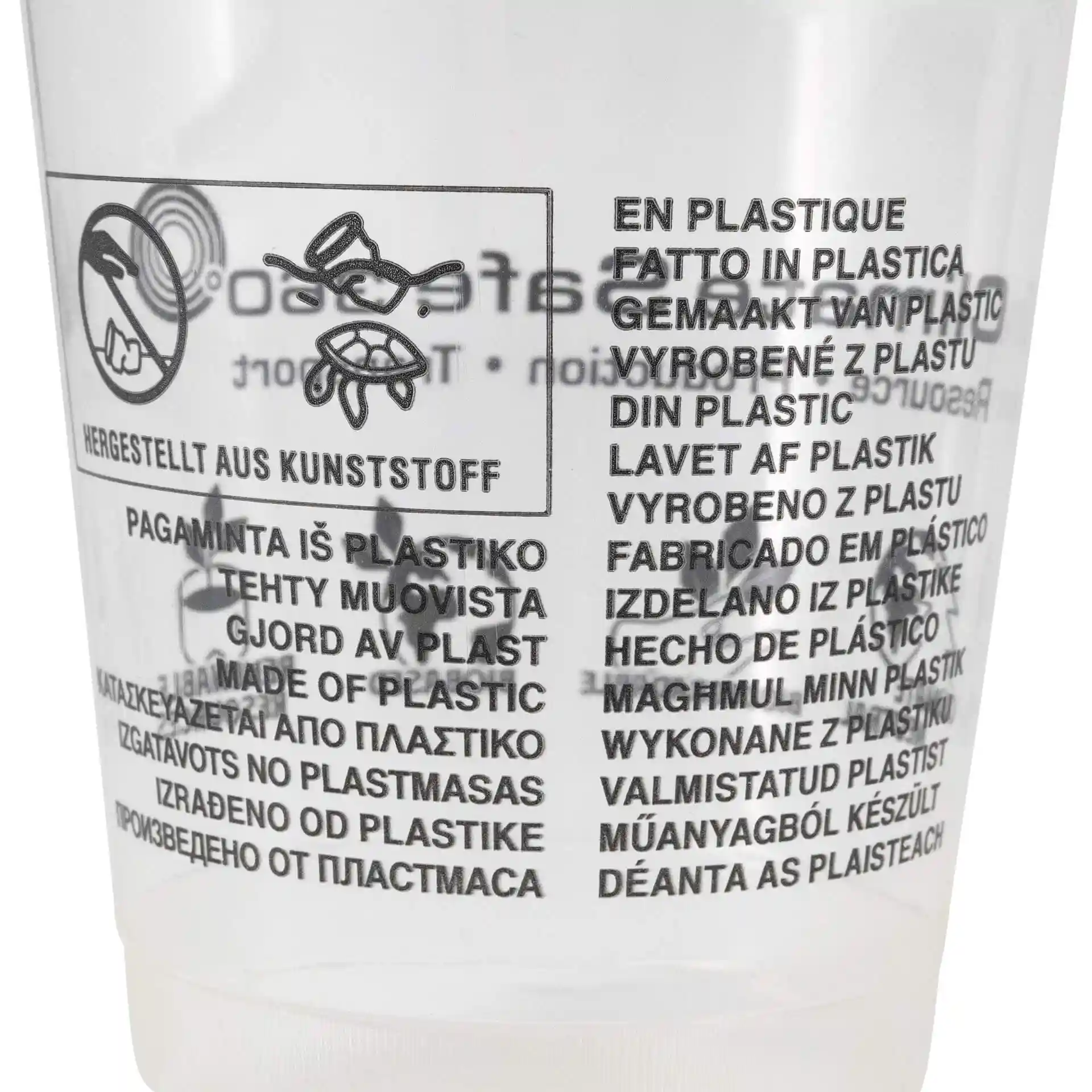 Transparent cup with printed multilingual text about plastic material and usage instructions.