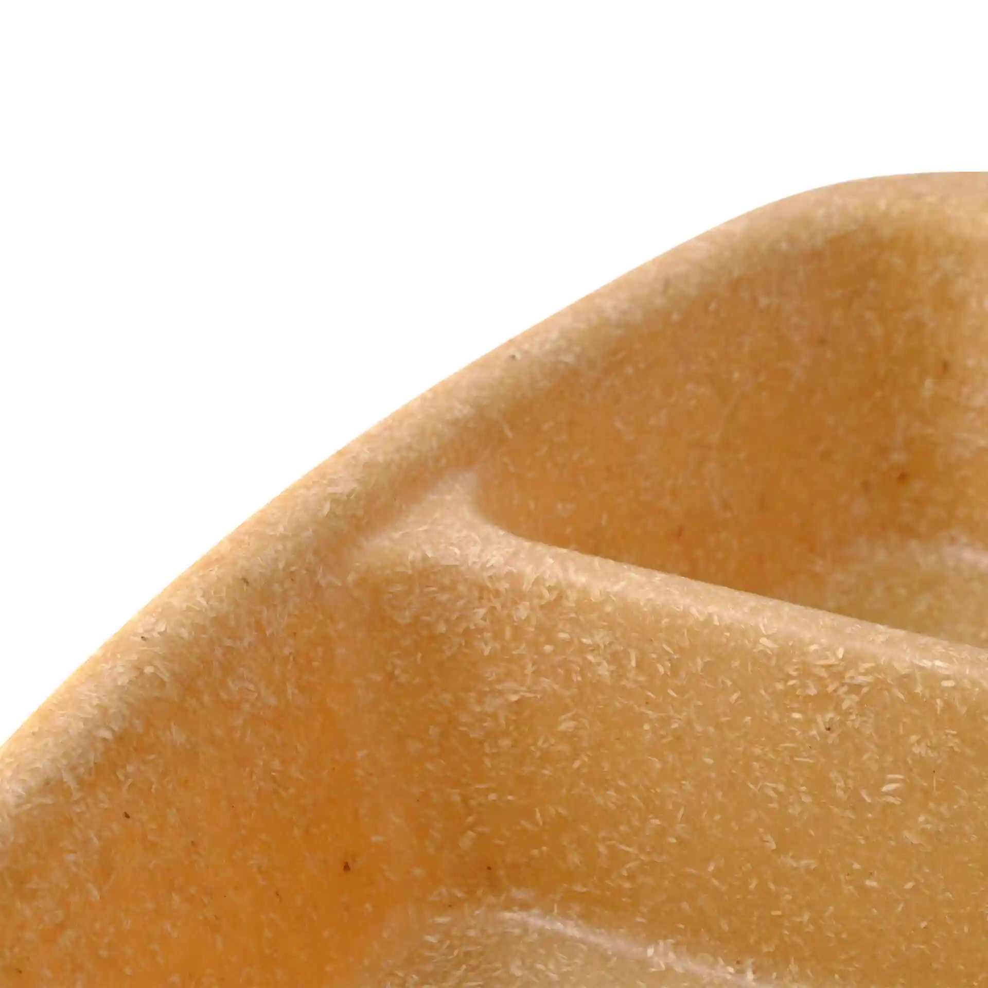 Close-up of a brown reusable meal container with three compartments, made from a bio compound material.