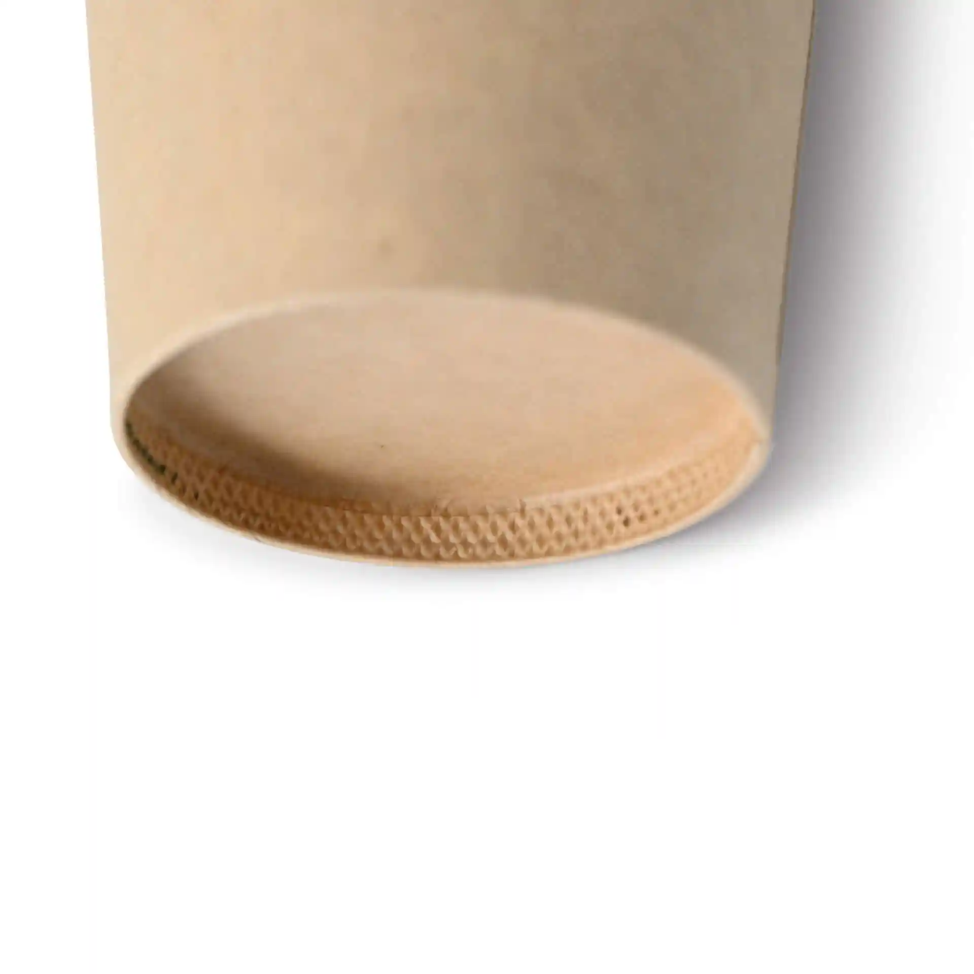 Close-up of the bottom of a brown paper cup with a coated surface and a textured rim.
