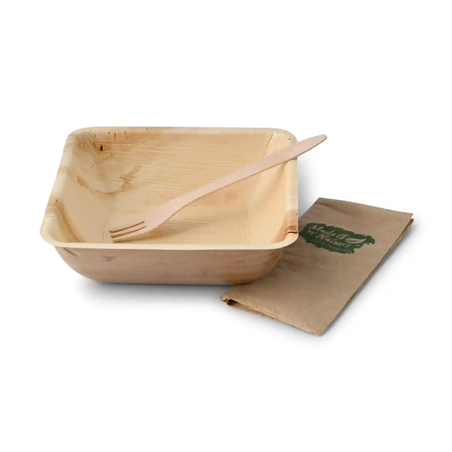 Square palm leaf bowl with a wooden fork and a folded brown napkin beside it.
