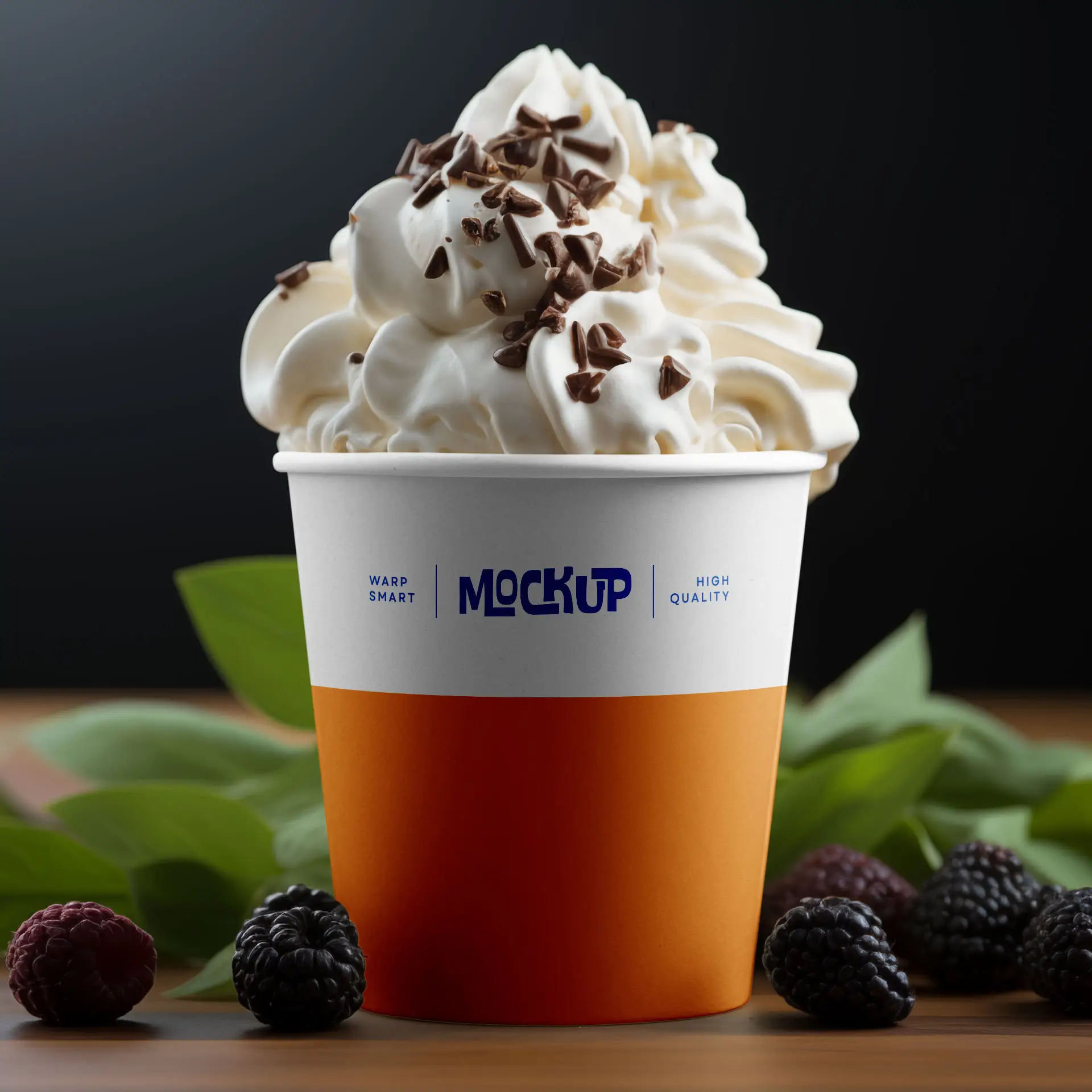 White ice cream cup with whipped cream and chocolate sprinkles, placed on a wooden surface with blackberries and leaves.