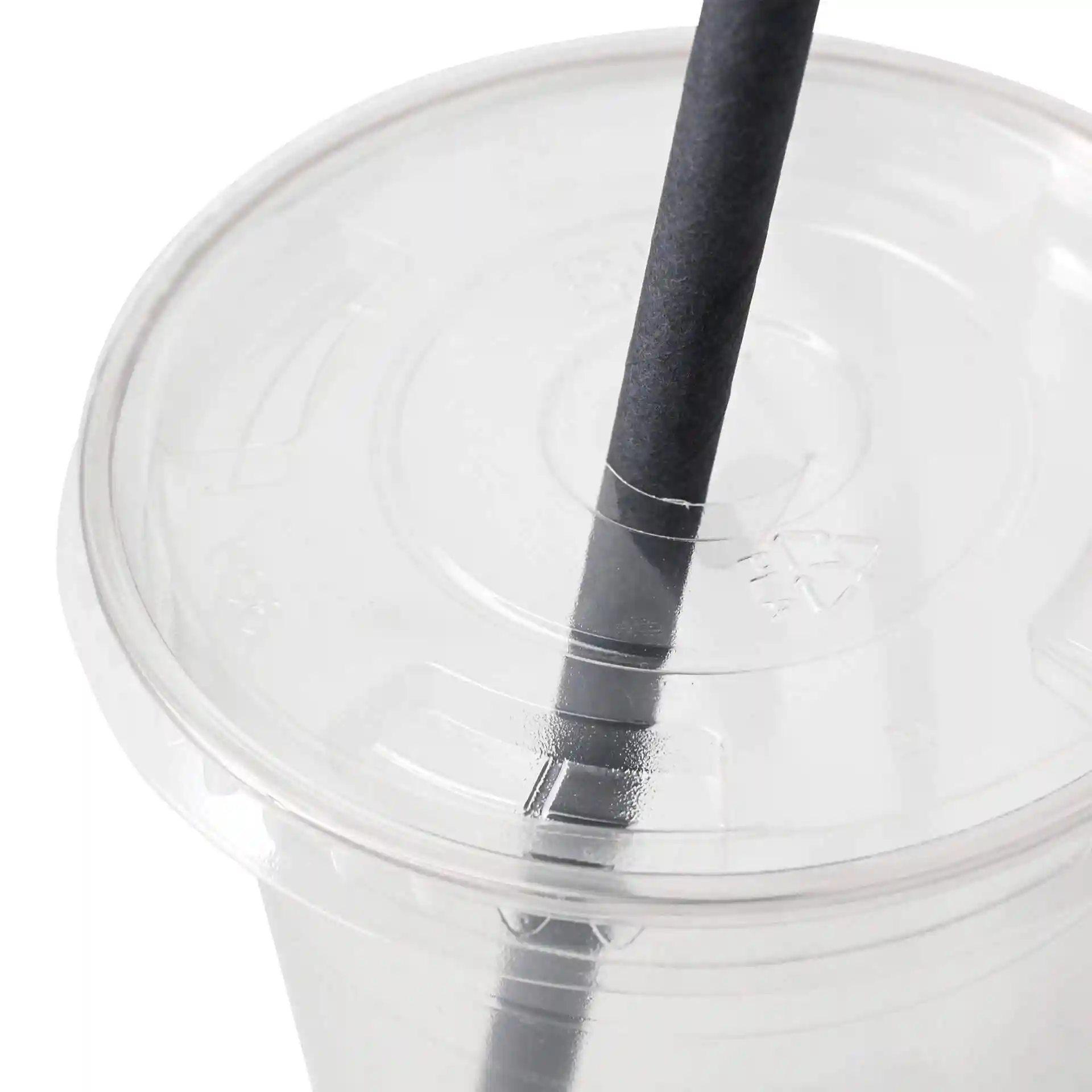 Transparent PLA flat lid with a straw hole, positioned on top of a cup, with a black straw inserted.