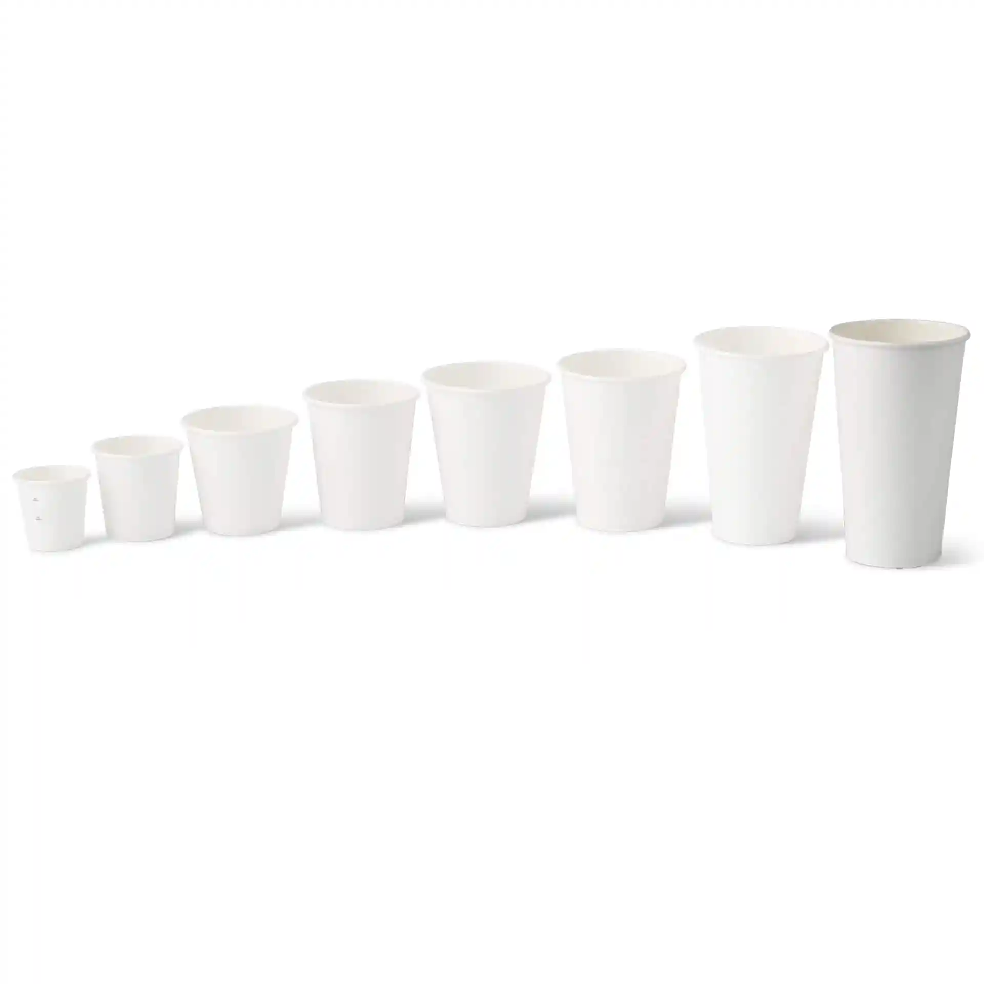 White paper cups in various sizes arranged in a row, with the largest cup on the right measuring 500 ml.