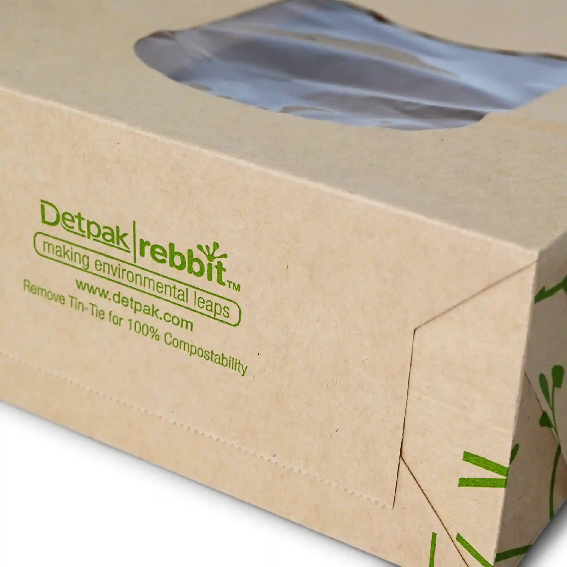 Brown kraft paper bag with a viewing window and tin tie closure, featuring printed green text and design elements.