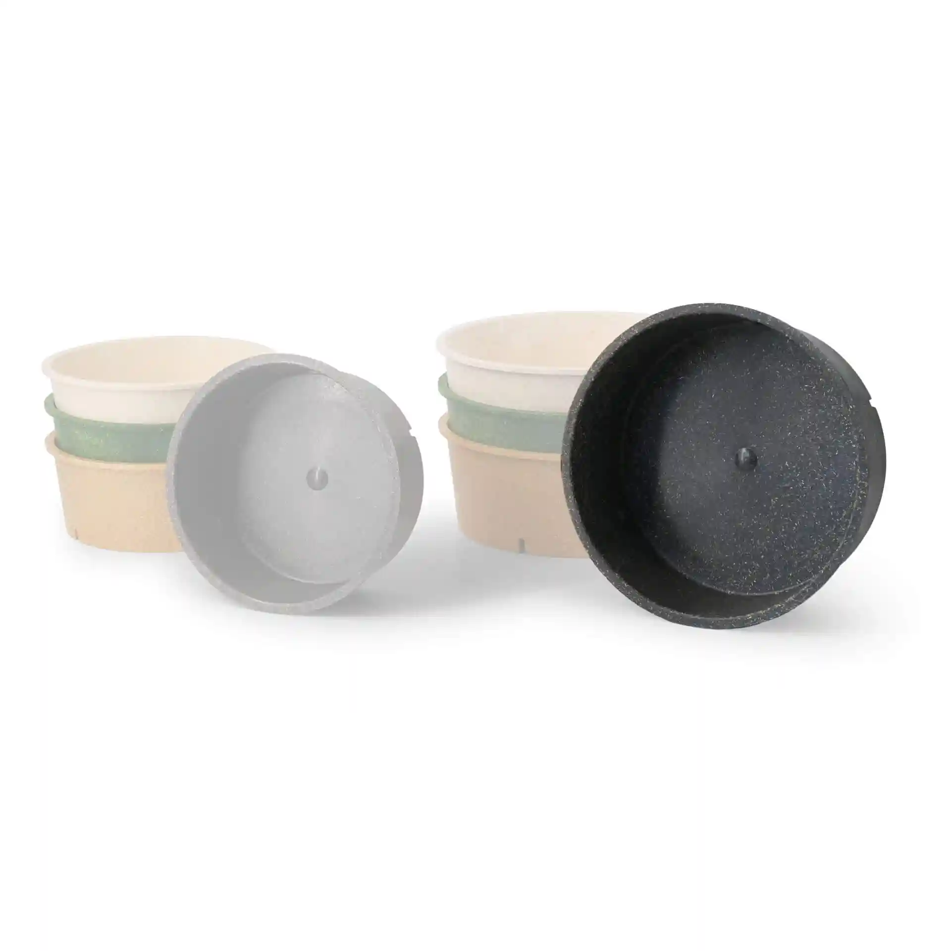 Image of several round reusable bowls in grey, with one bowl shown upside down to display the interior.