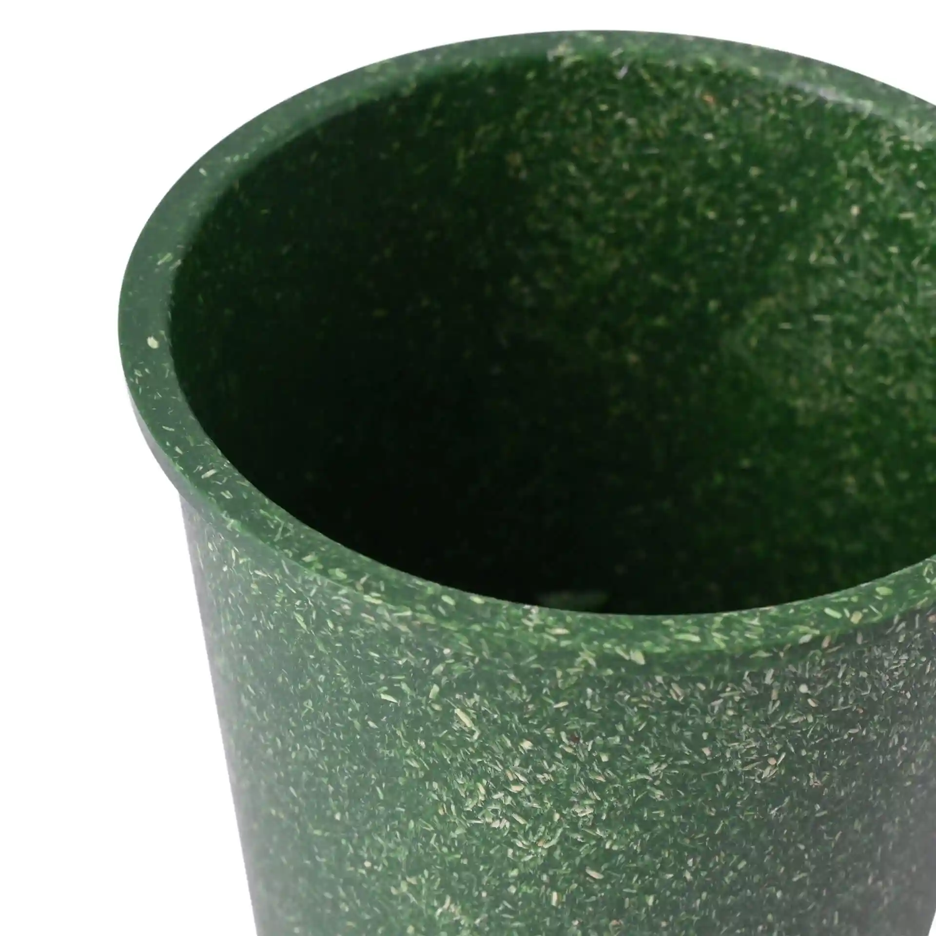 Green reusable cup with a round shape, made from bio compound, showing the interior and top edge.