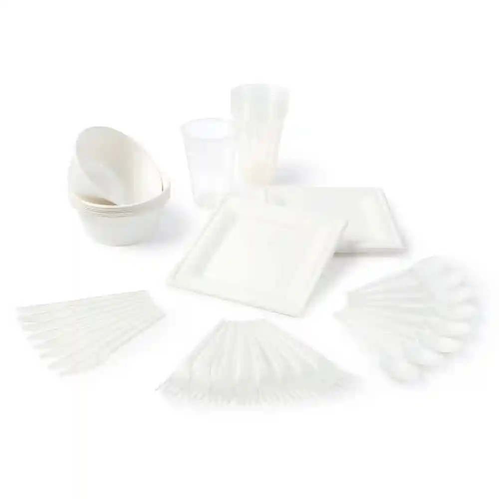 Set of disposable white plates, bowls, cups, forks, knives, and spoons arranged on a plain background.