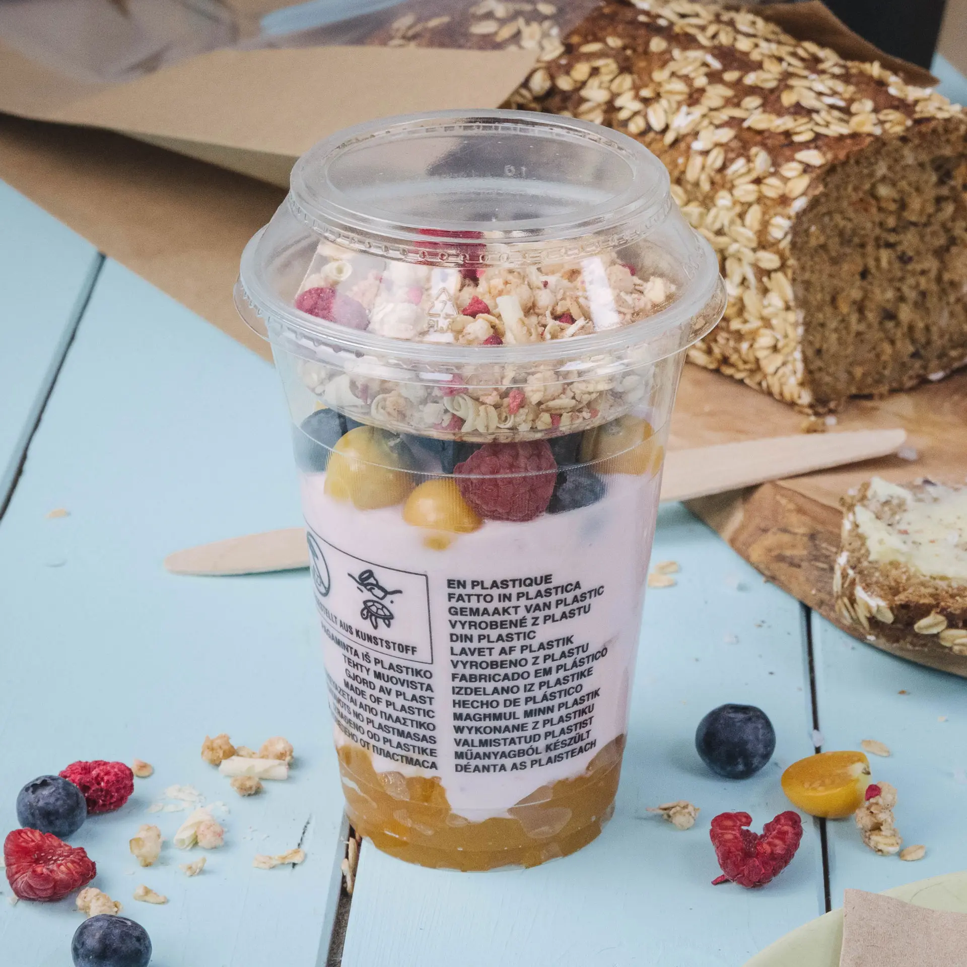 Clear plastic cup filled with yogurt, granola, and fruit, with a diameter of 95 mm and a volume of 130 ml.