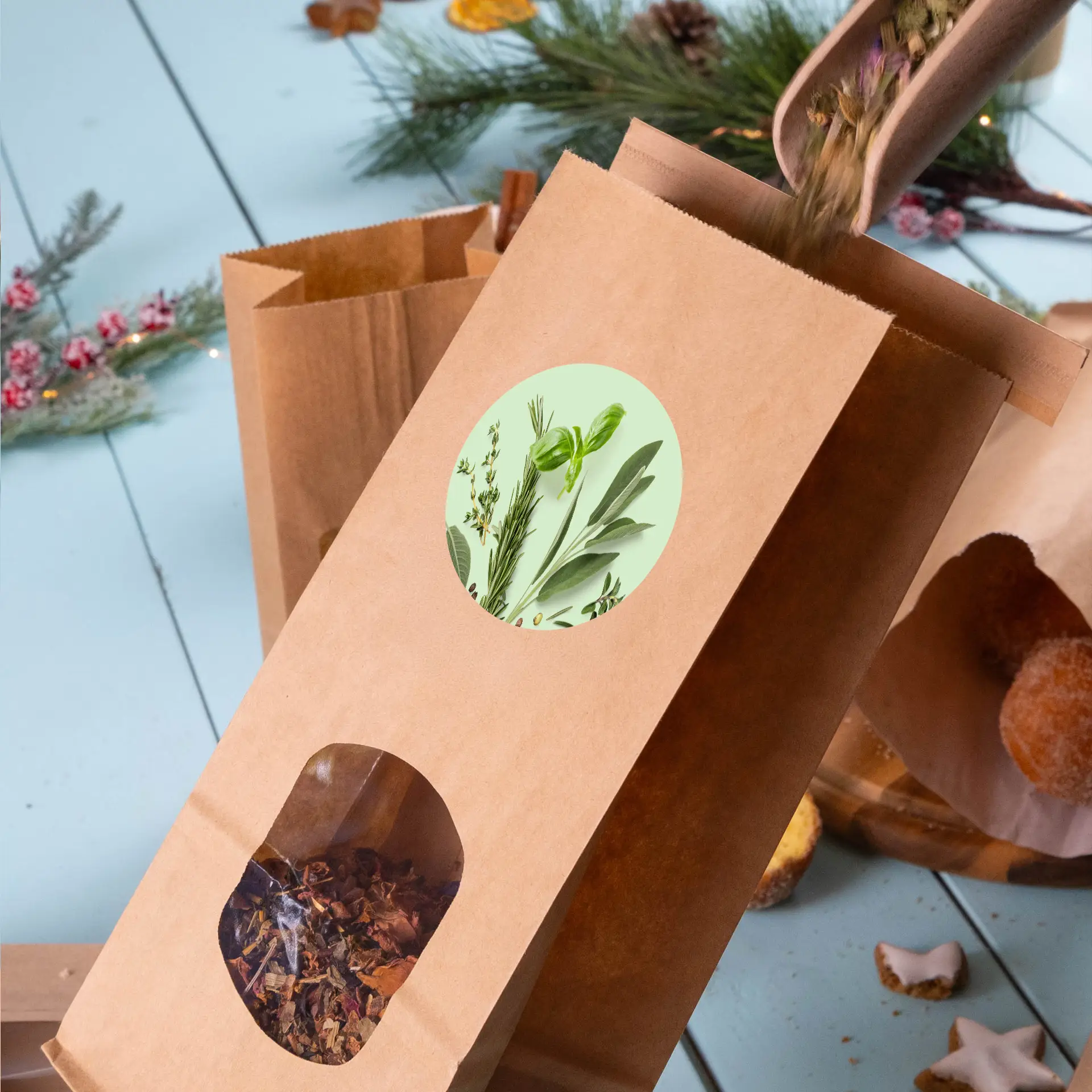 Brown paper bag with a window displaying dried herbs, topped with a round label featuring green plant illustrations.